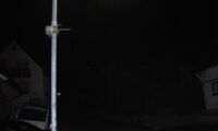 Bat recorder and information flyer attached to a street lamp. The bat recorder automatically detects bats flying past and records their ultrasonic sounds. Photo: Daniel Lewanzik